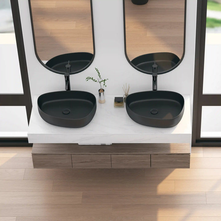 Two matte black oval solid surface vessel sinks double vanity set