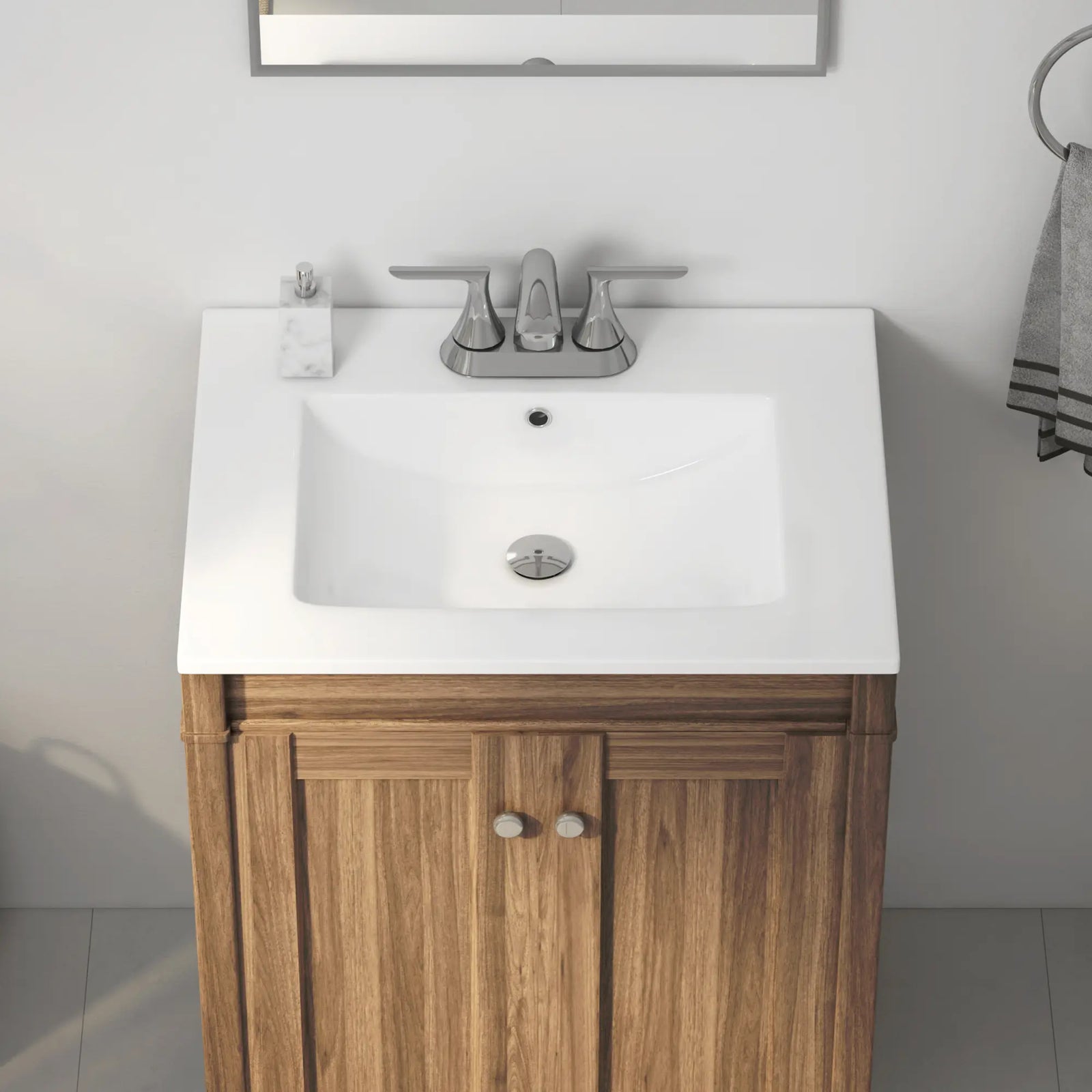 White ceramic integrated sink top on wood bathroom vanity cabinet.#faucet-mount_centerset