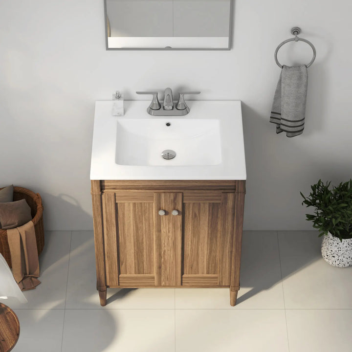 White ceramic integrated sink top on wood bathroom vanity cabinet