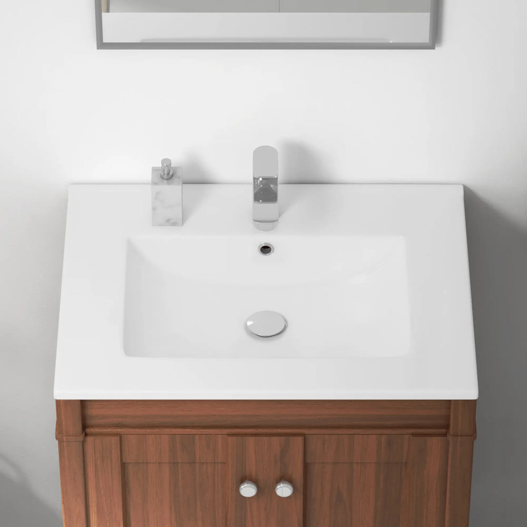 White rectangular vanity sink with single faucet hole and chrome drain.