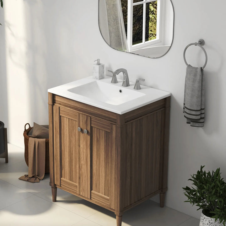 White ceramic rectangular bathroom sink with 3-hole chrome faucet.