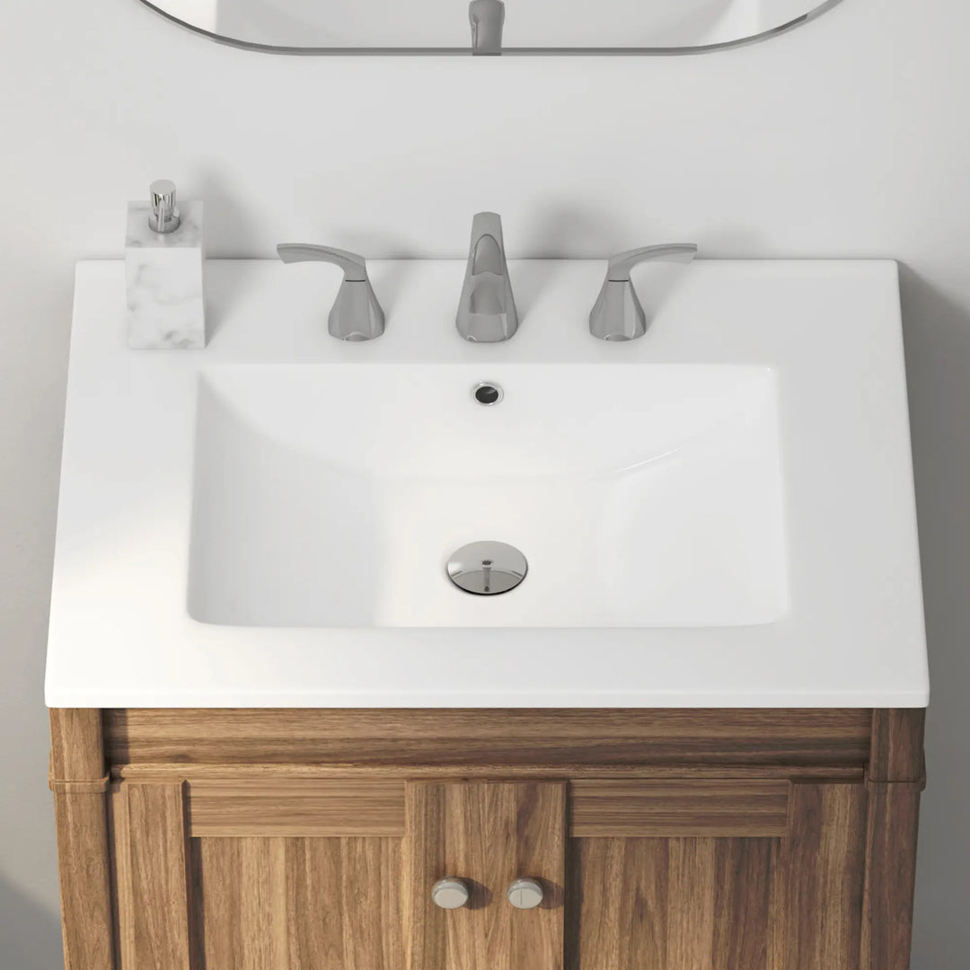 White ceramic rectangular bathroom sink with 3-hole chrome faucet.
