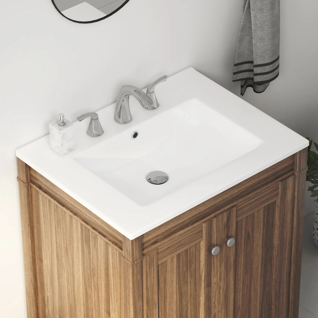 White ceramic rectangular bathroom sink with 3-hole chrome faucet.