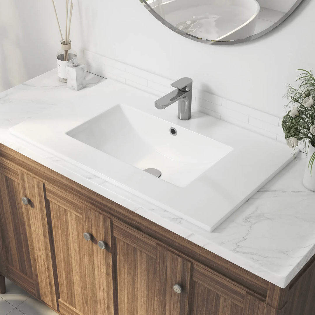 Rectangular white ceramic drop-in sink with modern faucet
