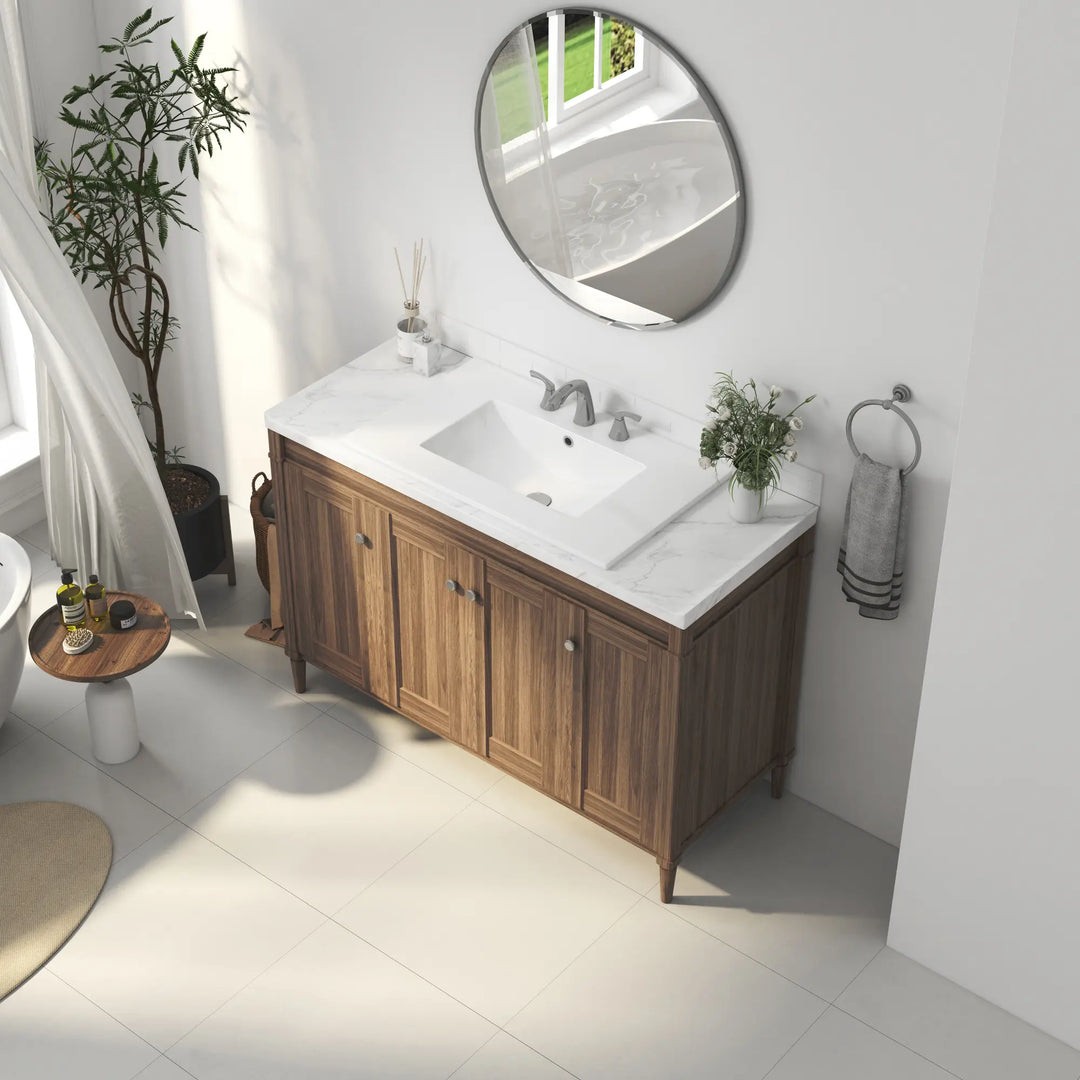 White ceramic rectangular vanity sink on wood cabinet