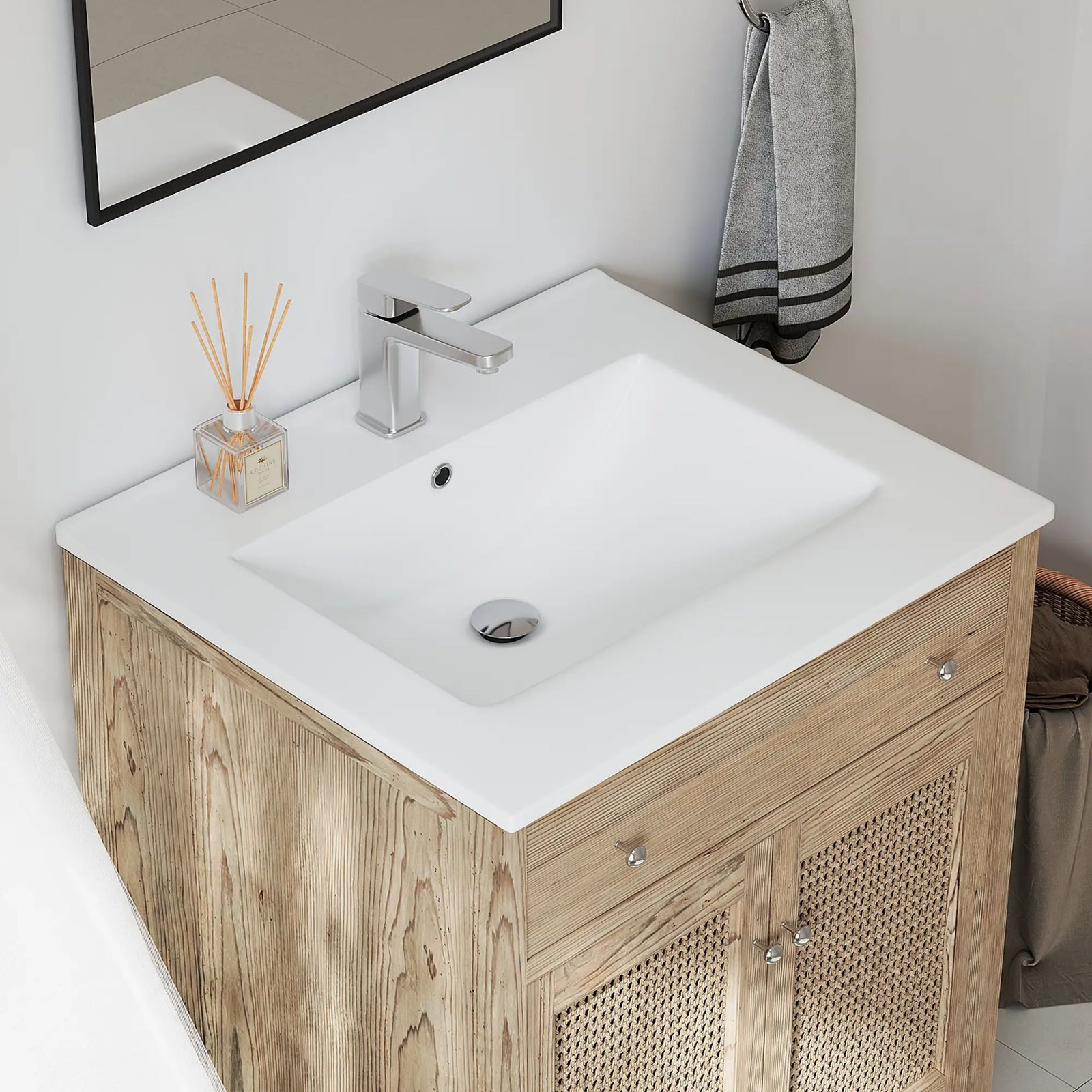 Top view of white rectangular bathroom sink with overflow and faucet.