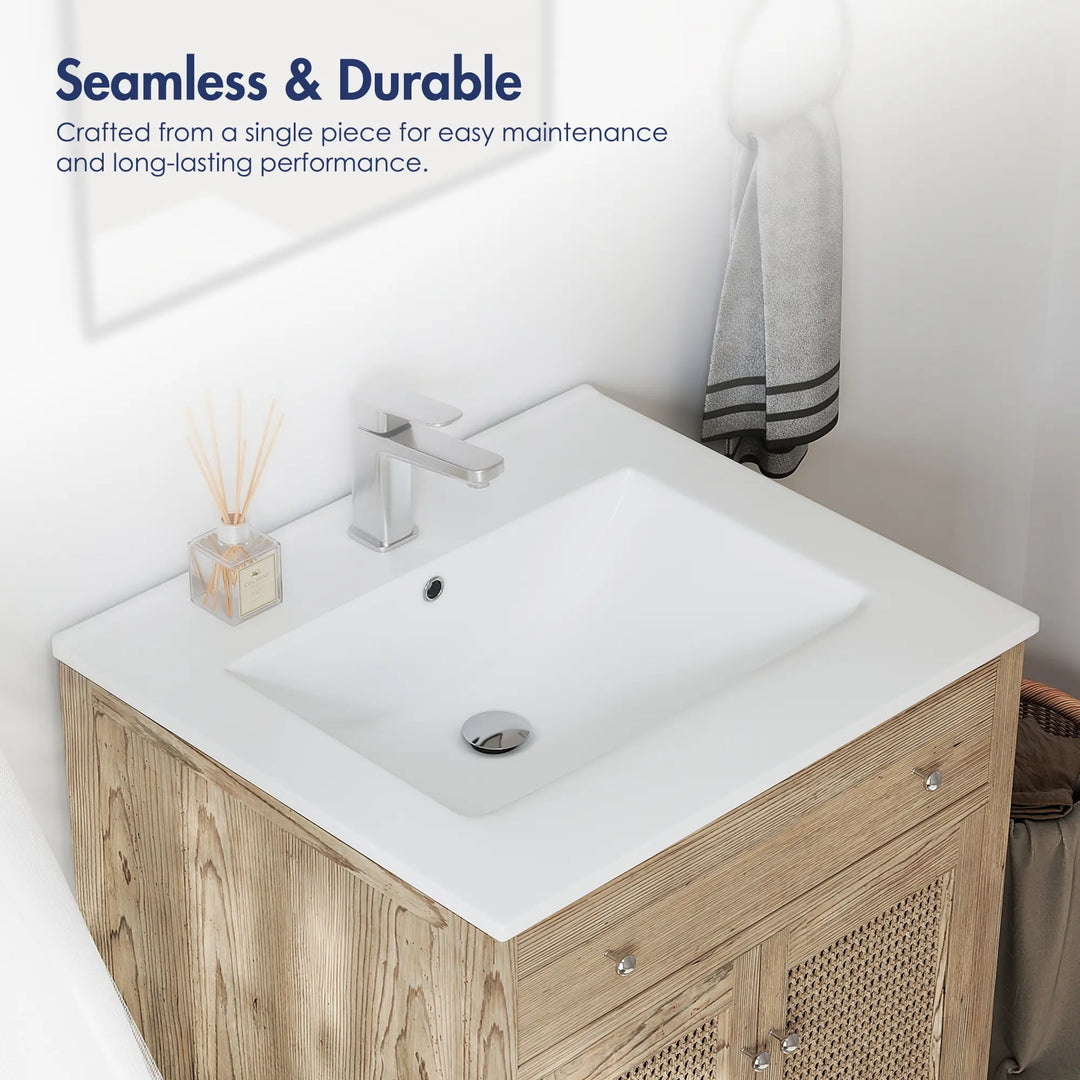 Seamless one-piece white vanity sink on a rustic wood cabinet.