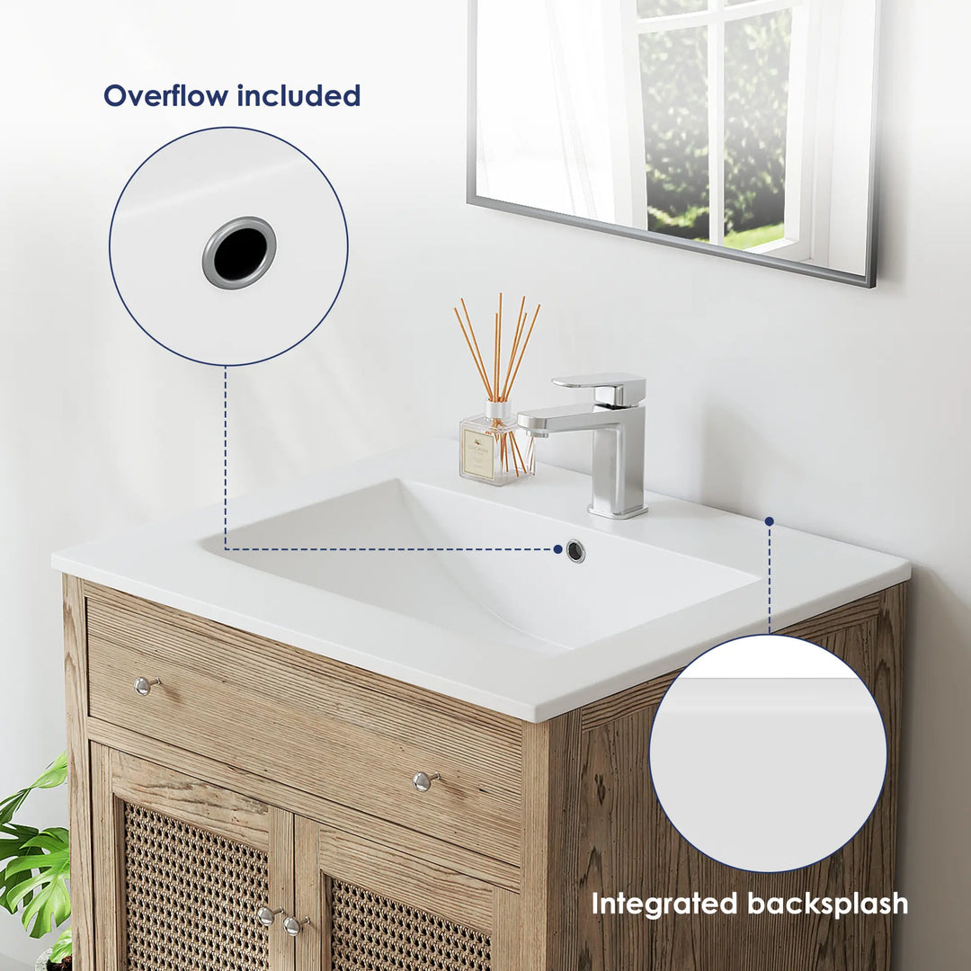 White vanity sink with integrated backsplash and overflow details.