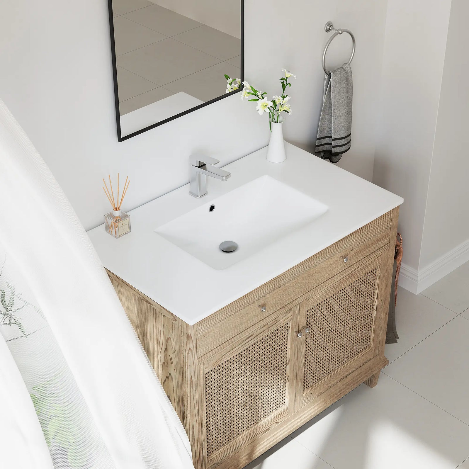White ceramic integrated sink top and oak wood rattan vanity.