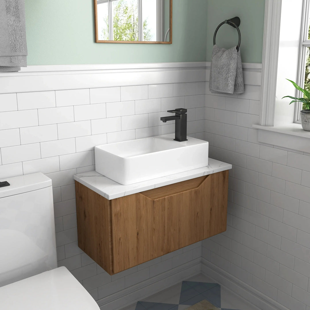Modern floating wood vanity with white marble top and ceramic vessel sink