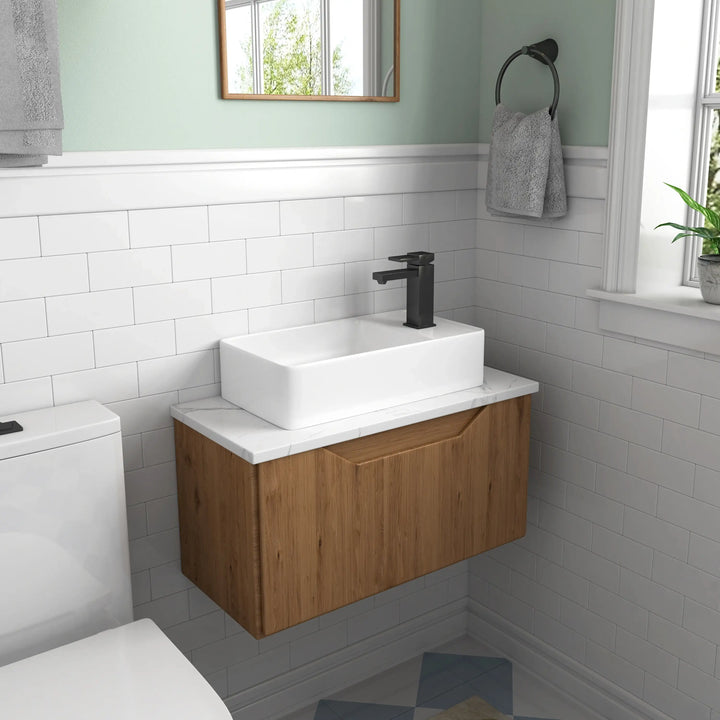 Modern floating wood vanity with white marble top and ceramic vessel sink