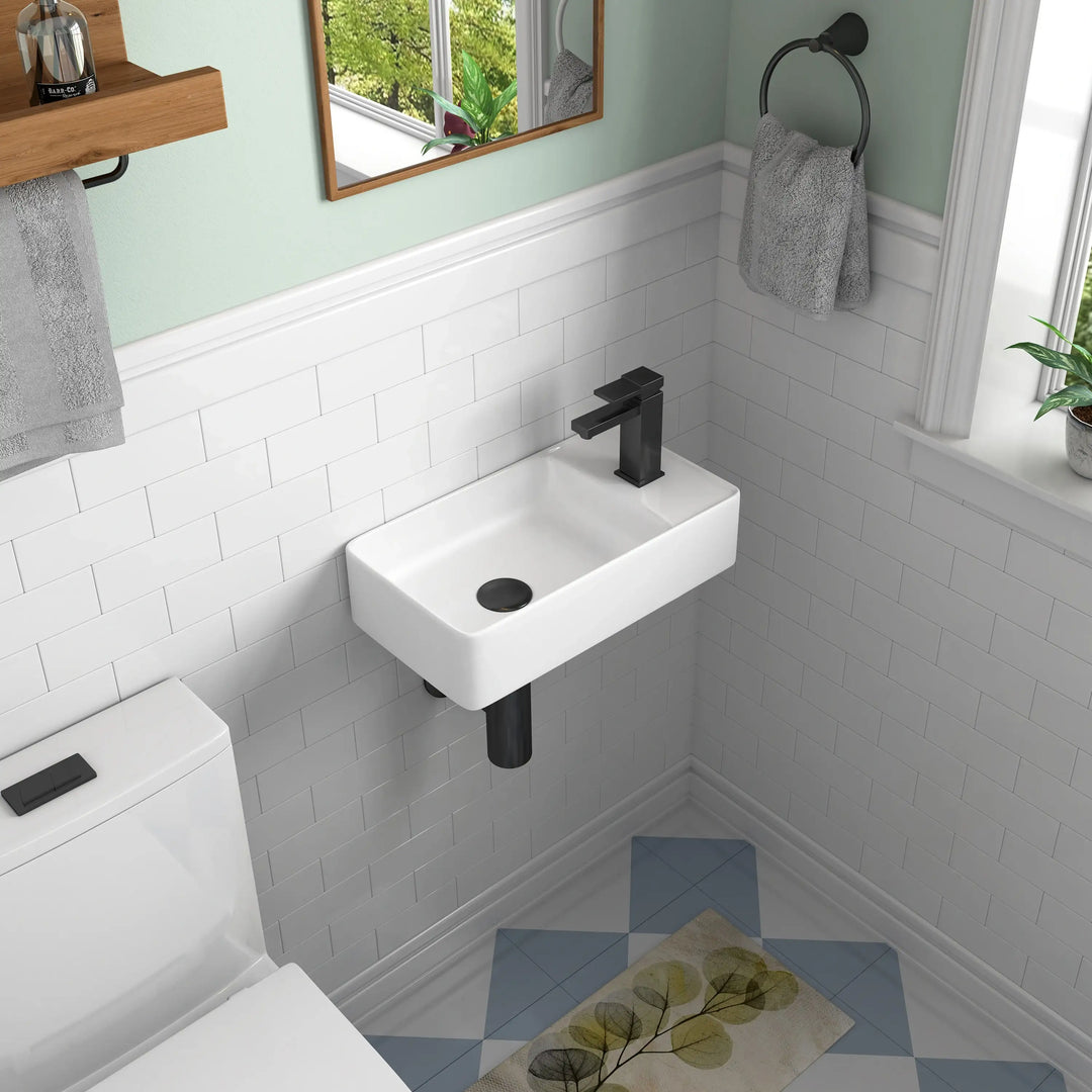 Wall-mounted white ceramic sink with matte black faucet