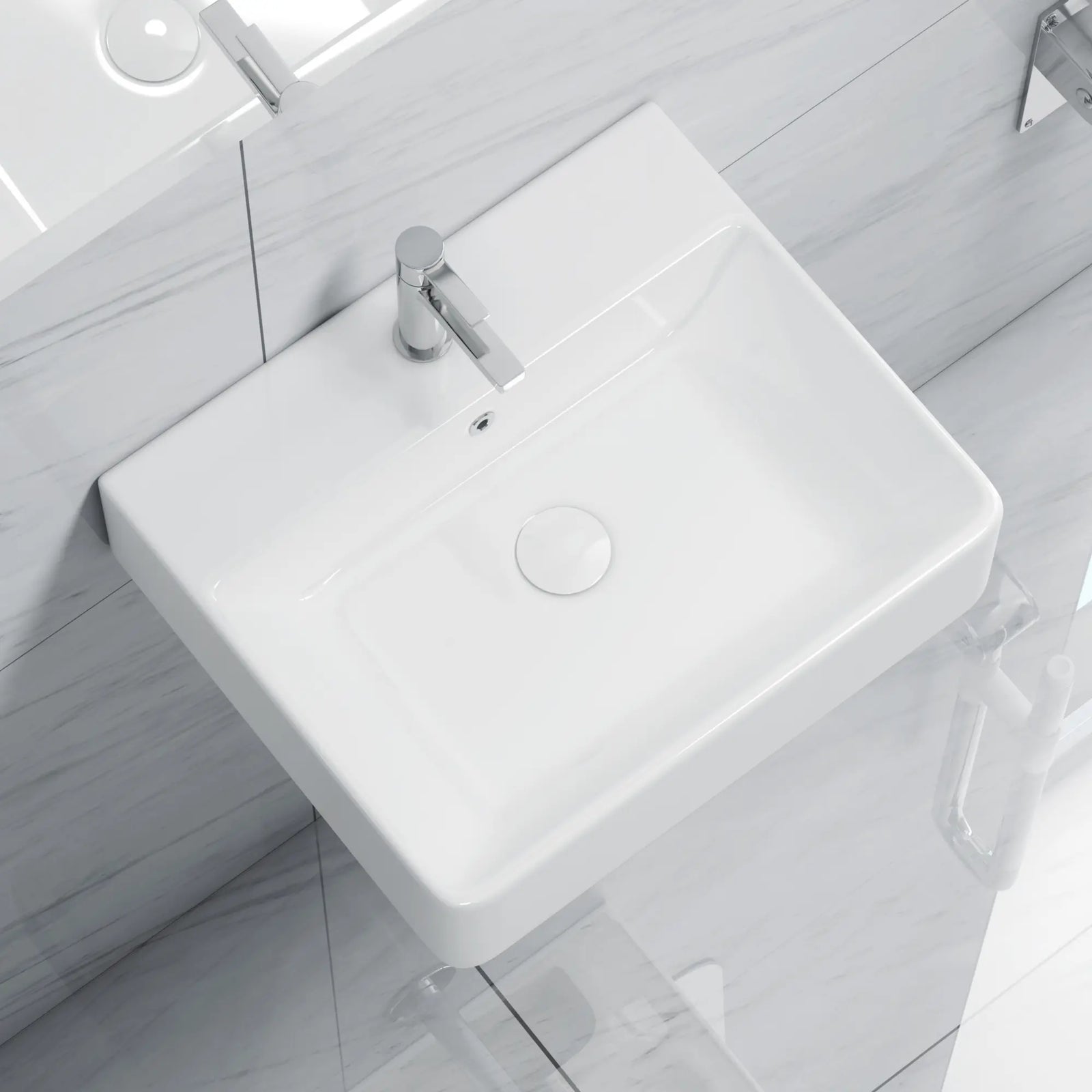White rectangular ceramic sink with chrome faucet and drain.