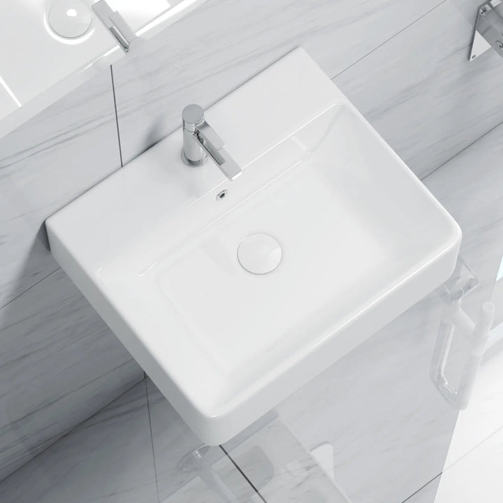 White rectangular ceramic sink with chrome faucet and drain.