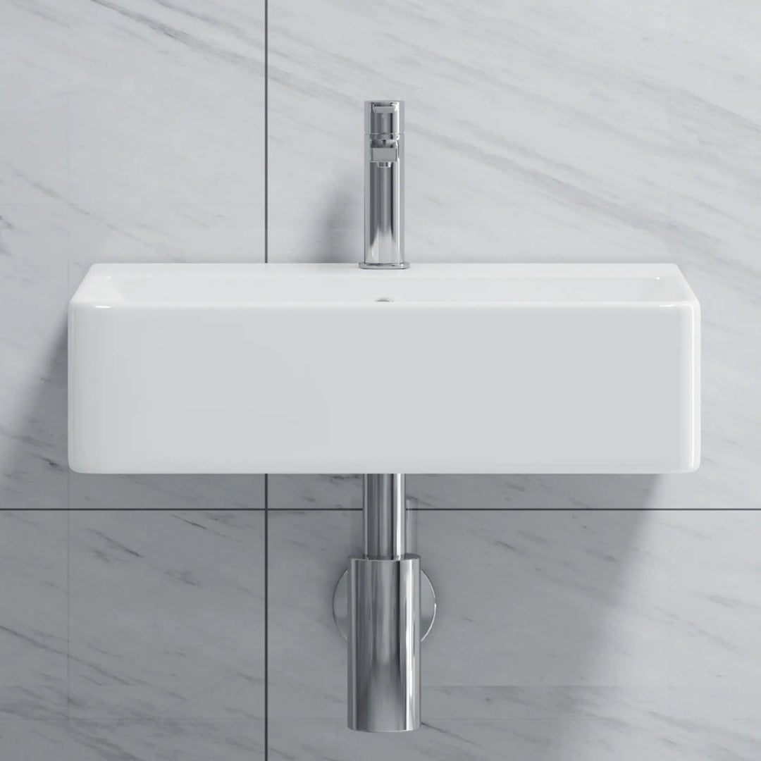 White rectangular wall-mount sink with chrome faucet.