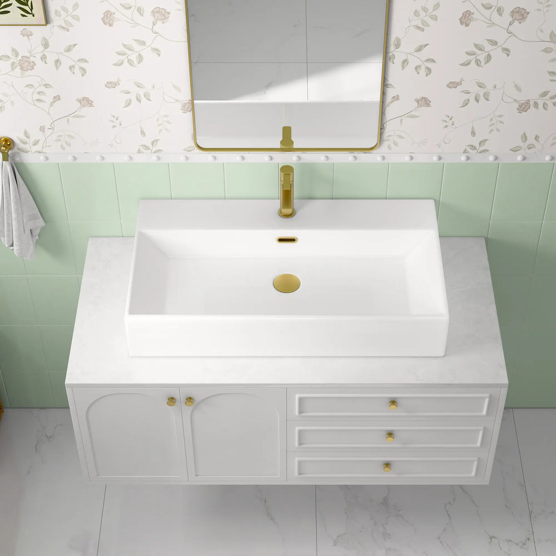 White ceramic single-hole sink with dimension markings.