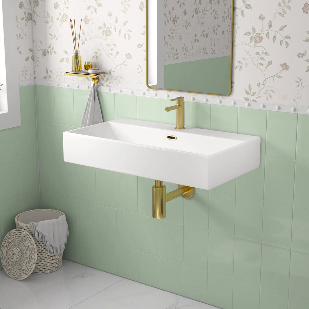 White ceramic single-hole sink with dimension markings.