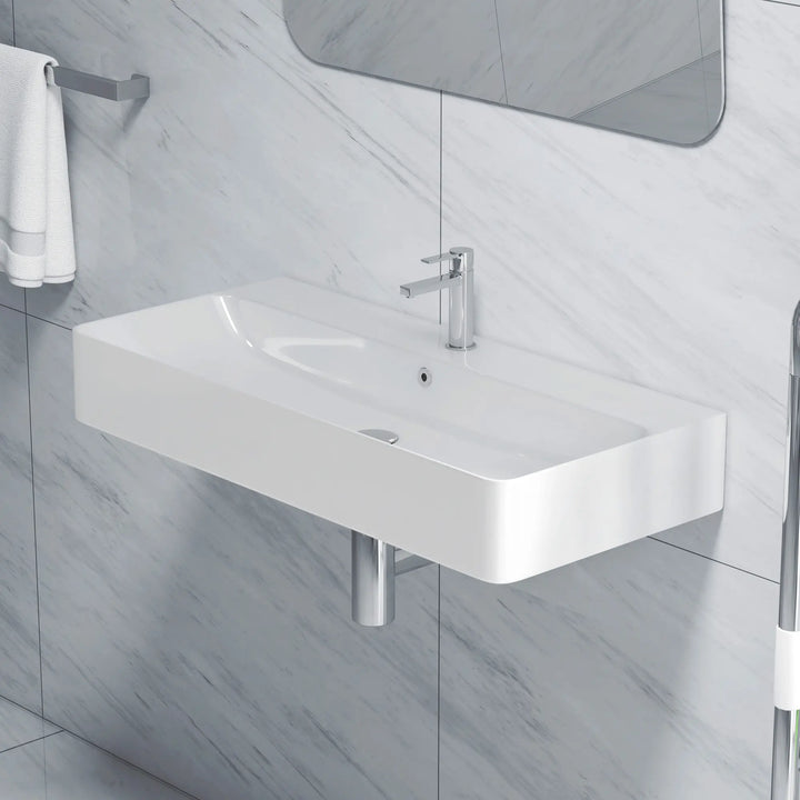 Wall-mounted white ceramic bathroom sink with integrated basin and single-handle faucet
