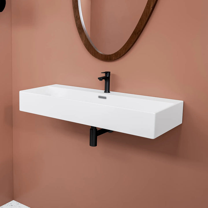 White rectangular ceramic wall-mount bathroom sink