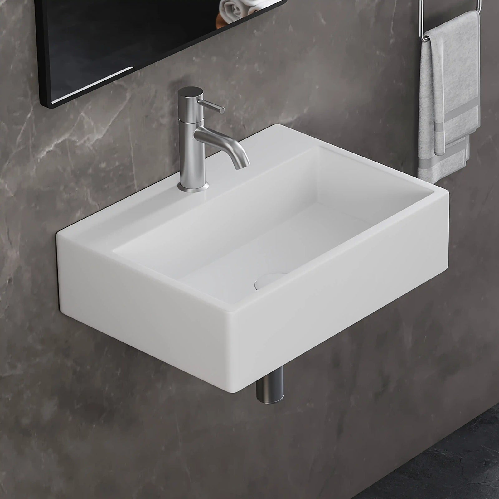 White rectangular wall-mounted solid surface bathroom sink with brushed nickel faucet