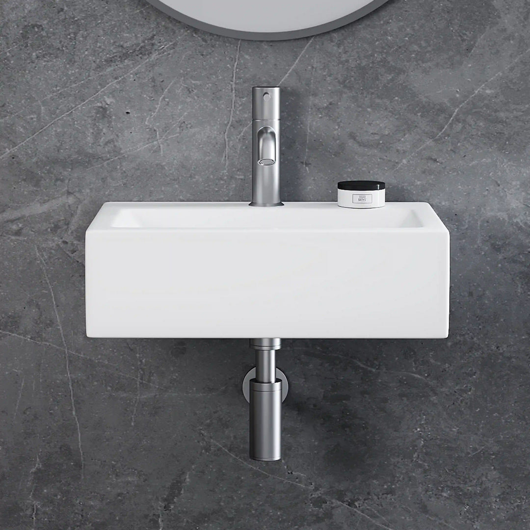 White rectangular wall-mounted ceramic vessel sink with brushed nickel pull-out faucet