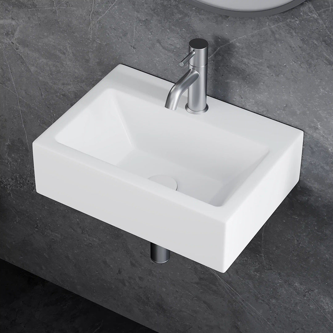 White rectangular wall-mounted ceramic vessel sink with brushed nickel pull-out faucet