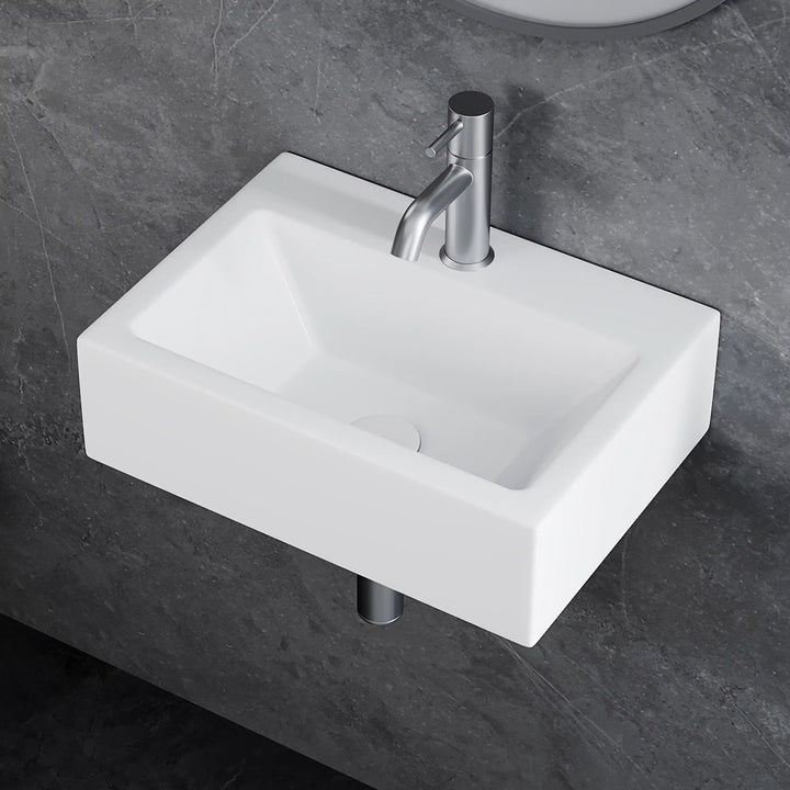 White rectangular wall-mounted ceramic vessel sink with brushed nickel pull-out faucet