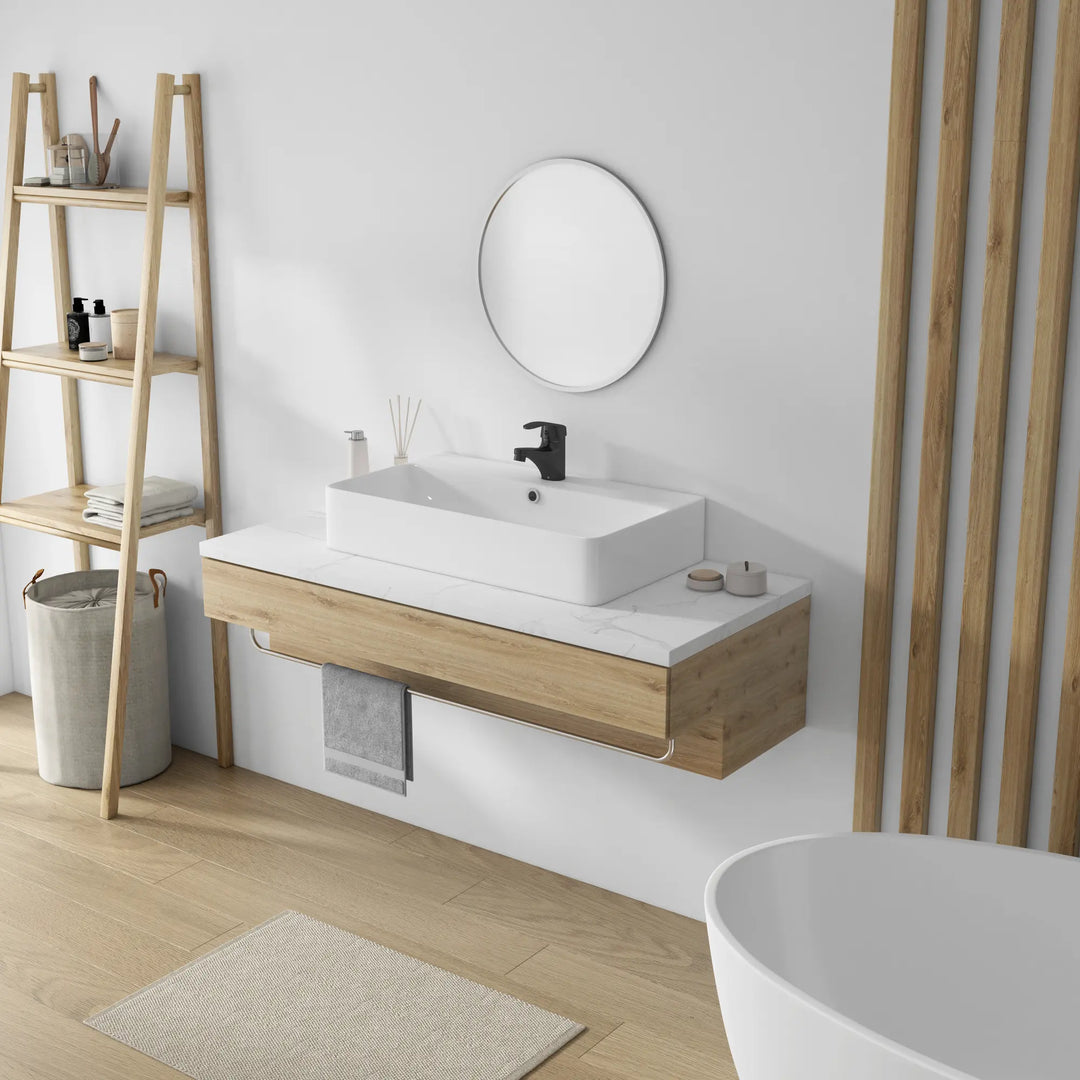 White rectangular ceramic sink, black faucet, wood grain floating vanity.