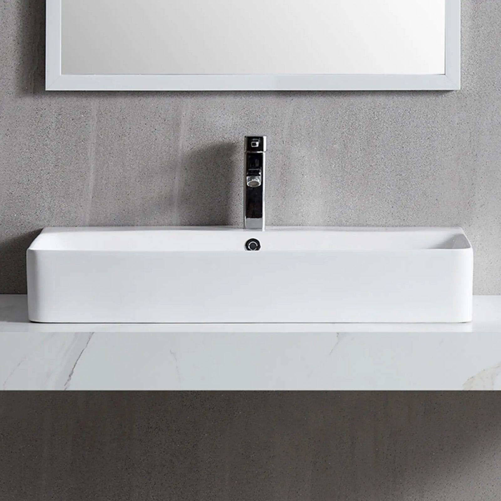 White rectangular ceramic vessel sink with chrome faucet