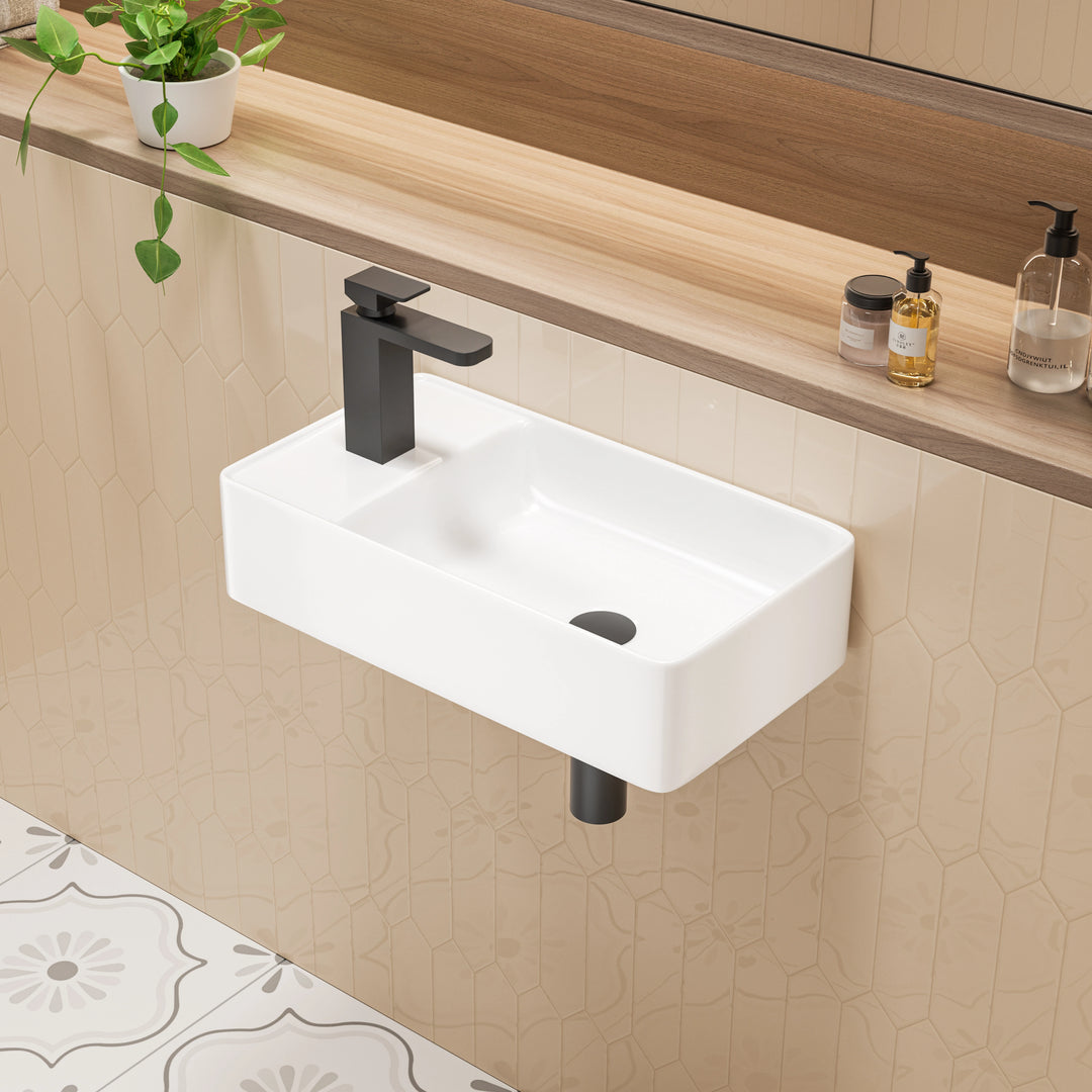 White rectangular wall-hung sink with black metal frame and shelf.